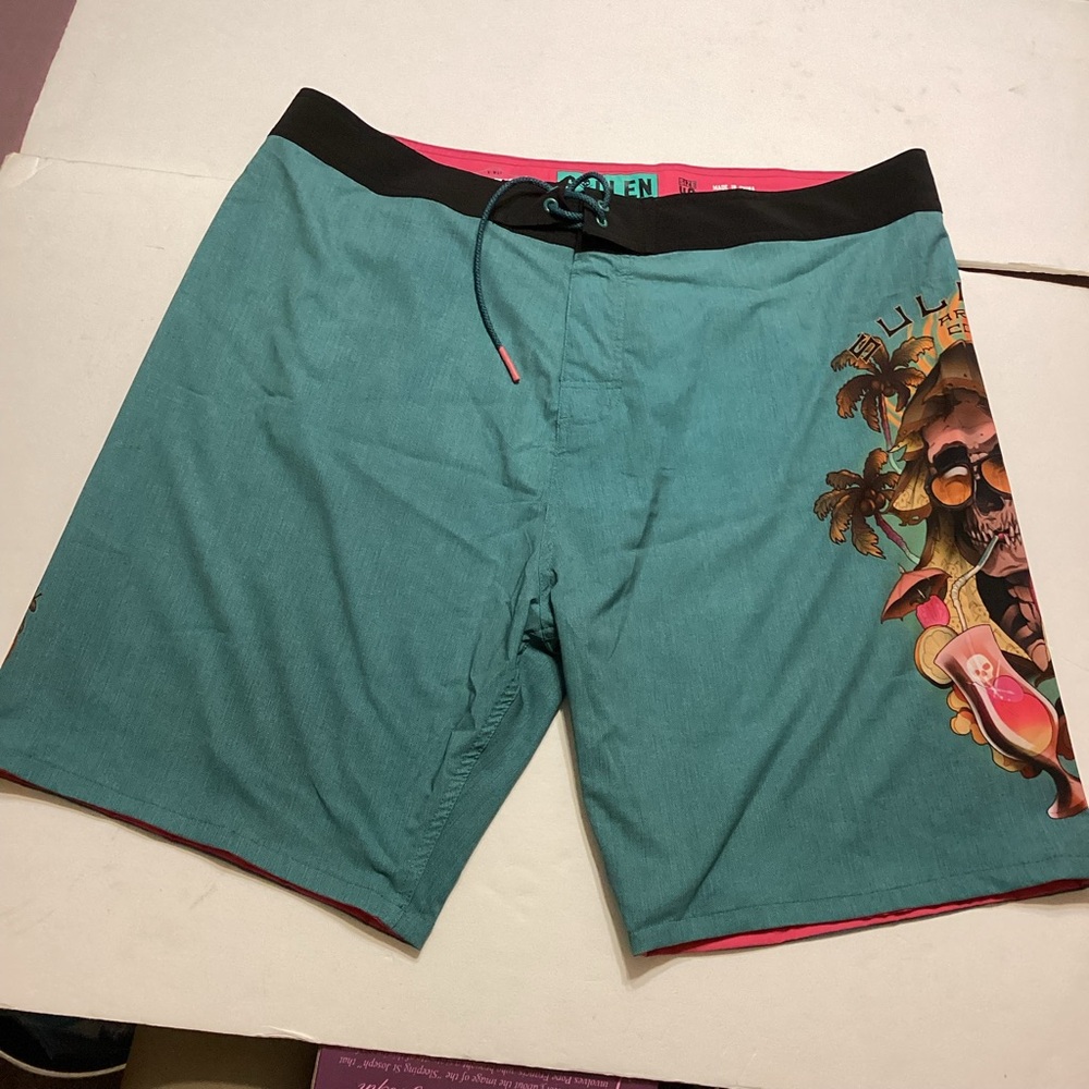 Stylish Teal Board Shorts with Graphic Design